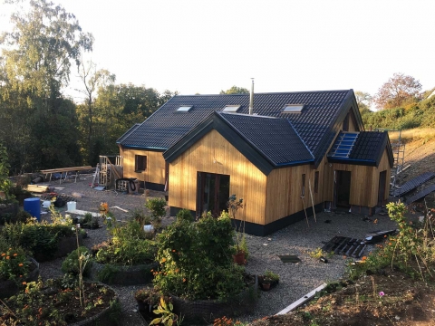 The house and raised beds in the evening sun October 2020